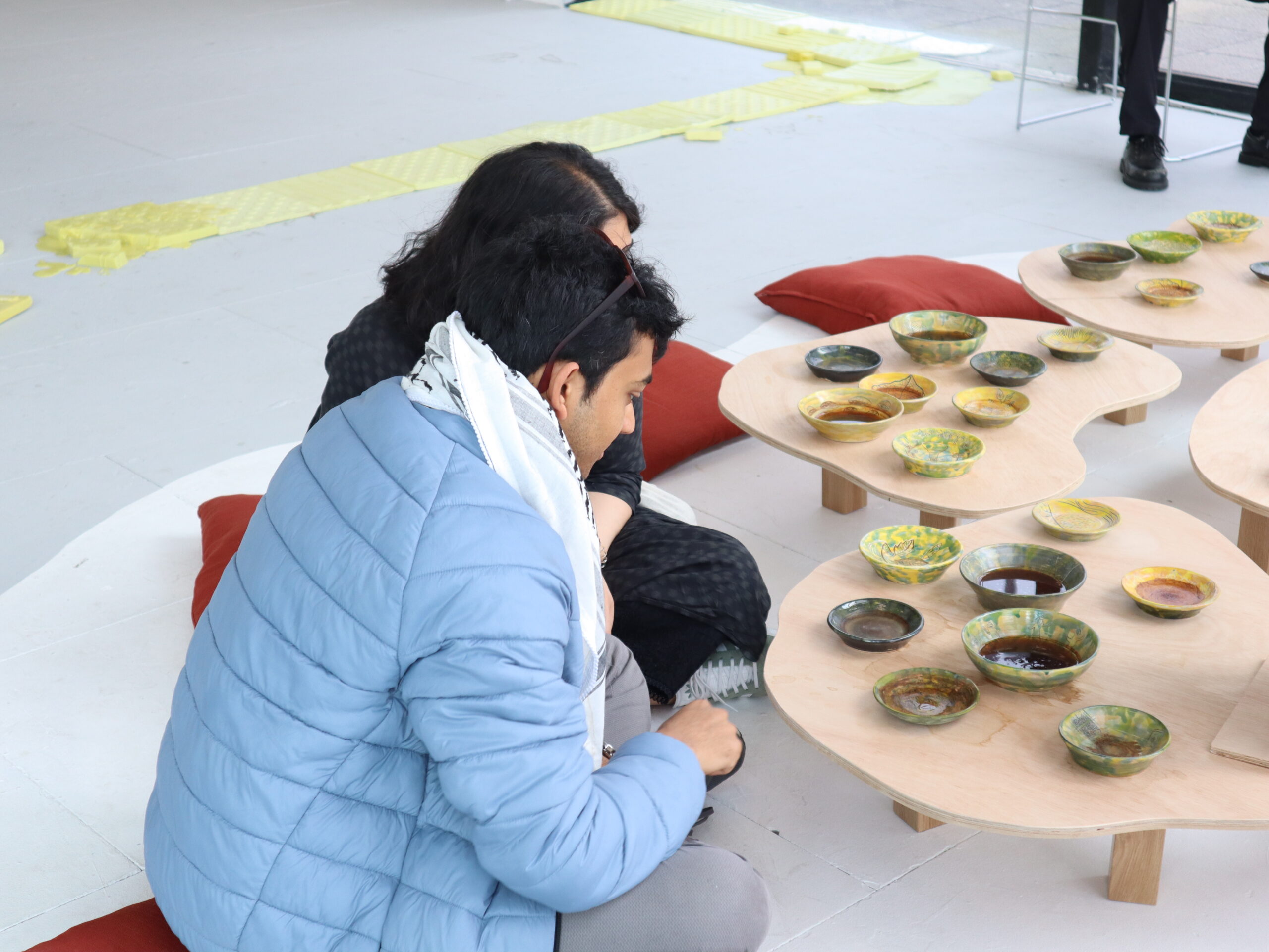Visitors engaging with the deceremony performance and art works